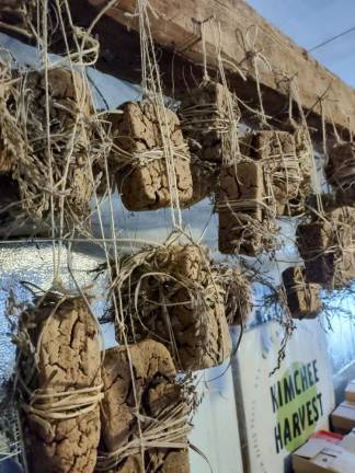 Meju blocks of fermented soybeans drying with rice grasses before going into the onggi, an earthenware crock.