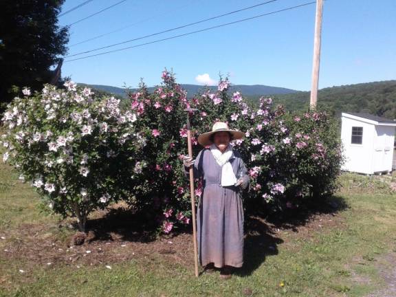 Ji Young Kim (pictured) told her farmer daughter, “You gotta build a kimchi kitchen.” She is standing in front of rose of Sharon, also known as mugunghwa, Korea’s national flower.