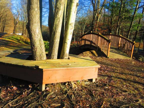 Tree benches and decorative bridge along O&amp;W rail trail, Mountain Dale to Woodridge section (Photo by Pamela Chergotis)