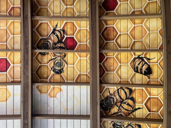 The honeybee mural adorning the ceiling of the Chef’s Garden Restaurant at Crystal Springs Resort.