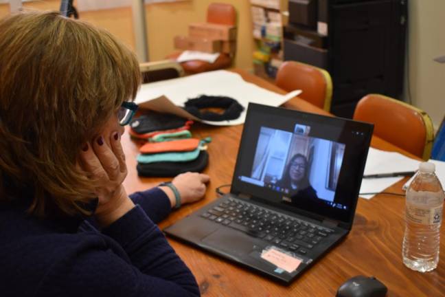 Katherine Brieger, executive director of the Warwick Area Farmworkers Organization, on a Zoom call with Celine Arizpe Benitez, 18, who’s studying business at SUNY Oneonta.