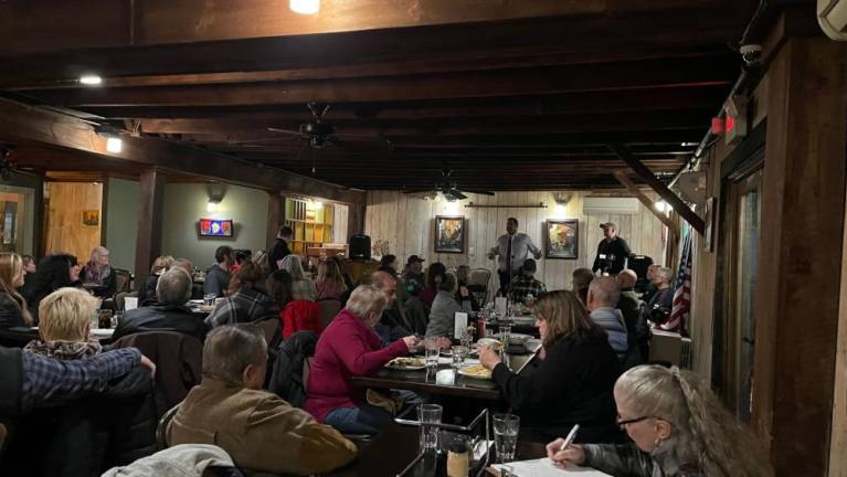 Paul Arteta waits to speak while Juan Ayala addresses Orange Strong on March 30 in Chester, N.Y. (Photo by Daniel Donnelly)