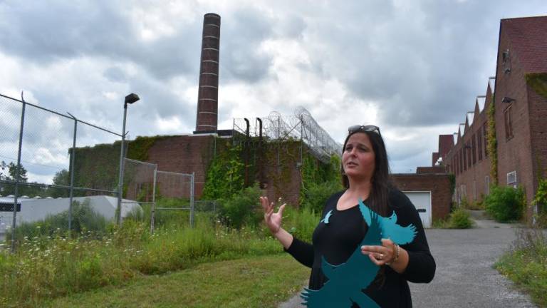 Sweetman with her bluebirds at the old prison site in July.